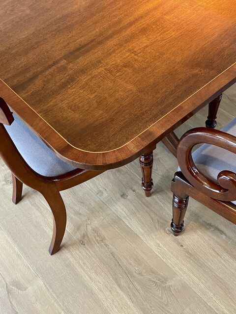 An English Edwardian Mahogany Extending Dining Table and A Set of Eight William IV Mahogany Chairs.