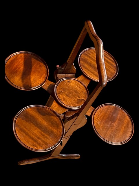 An English Edwardian Mahogany Folding ' Monoplane ' Cakestand.