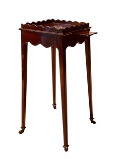 An English Edwardian Mahogany Kettlestand on Castors.