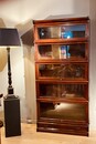 An English Late 19th Century Mahogany Globe Wernicke Bookcase . Five Sections High.