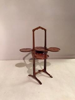 An English Mahogany Monoplane Cake Stand signed.