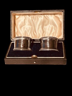 An English Pair of Sterling Silver Napkin Holders in the original Case.