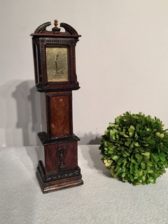 An English Rosewood and Mahogany 19th Century Miniature Clock having a beautiful Floral Inlay. M Hammond 1889.
