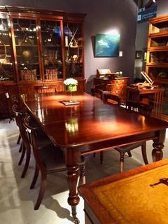 An English William IV Mahogany Extending Dining Table having two original leaves.