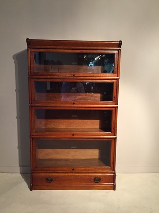 An Englsh 19th Century Oak Globe Wernicke Bookcase. Four Sections.