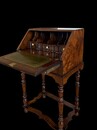 Elegant antique English small bureau in burr walnut with a fitted interior, original leather writing surface and beautiful warm patina.