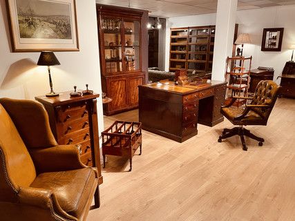 English Wing Back Chair, A Wellington Chair, A Partner's Desk, A Desk Chair, A Victorian Bookcase, Globe Wernicke Bookcases.